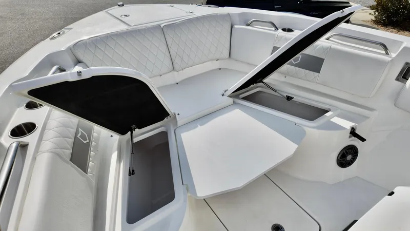 Slide: The Image of 2025 Sea Fox 268 Commander boat interior with open storage compartments and cushioned seating. - 15