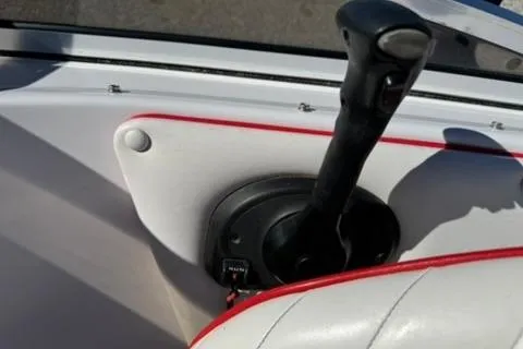 Slide: The Image of 2001 Donzi 16 Classic boat throttle control with red-trimmed white interior. - 11