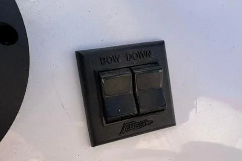Slide: The Image of Control panel on a 2001 Donzi 16 Classic boat with "Bow Down" buttons. - 12