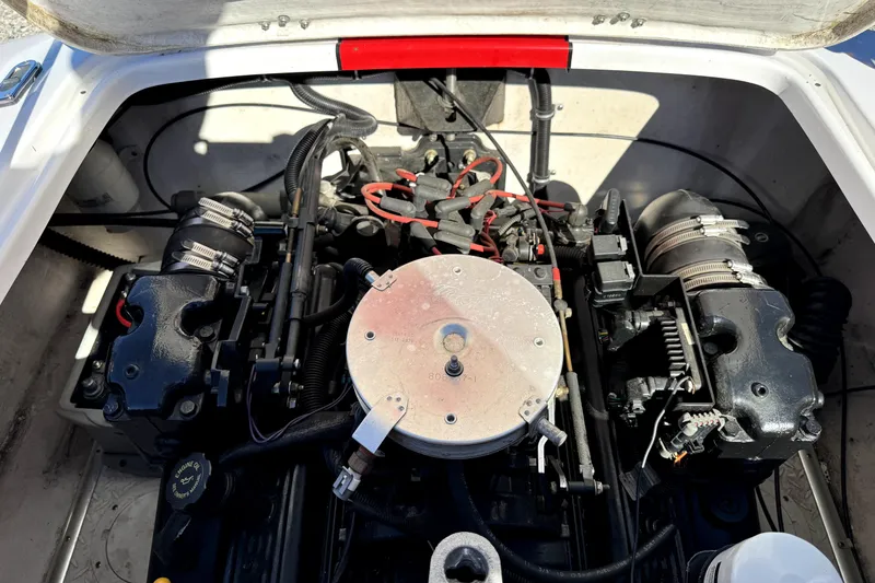 Slide: The Image of Engine compartment of a 2001 Donzi 16 Classic boat, showcasing mechanical components. - 13