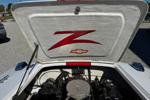 Slide: The Image of 2001 Donzi 16 Classic boat engine compartment with Chevrolet logo and red "Z" emblem. - 16