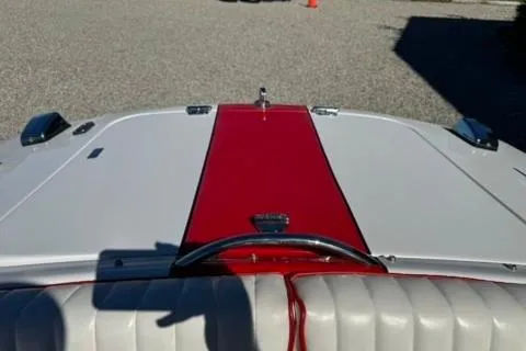 Slide: The Image of 2001 Donzi 16 Classic boat with red and white upholstery, viewed from the cockpit. - 17