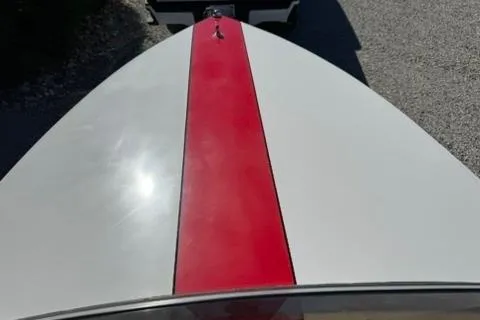 Slide: The Image of 2001 Donzi 16 Classic boat with red stripe on white hull. - 8