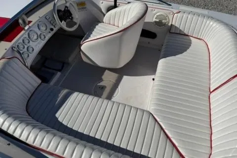 Slide: The Image of 2001 Donzi 16 Classic boat interior with white and red-trimmed seating. - 9