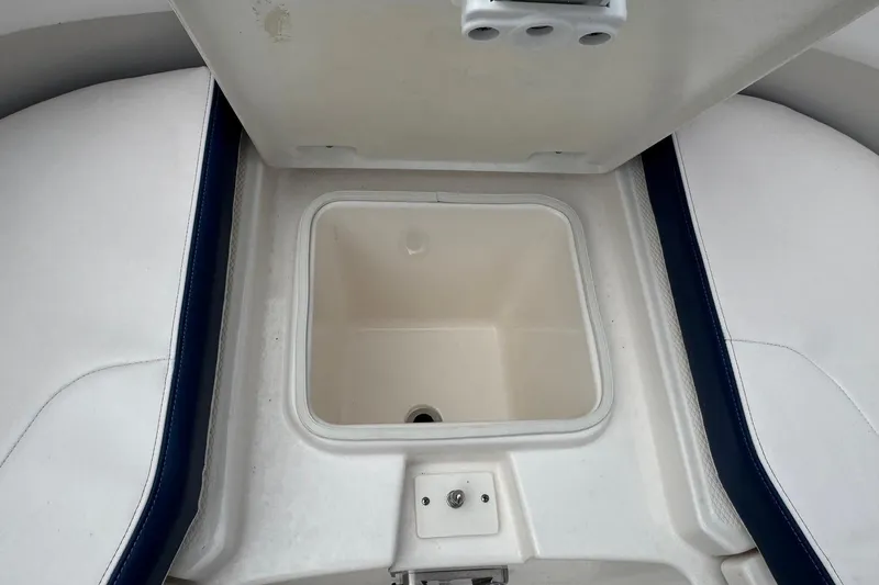 Slide: The Image of Open storage compartment on 2021 Robalo R242 Explorer boat. - 10