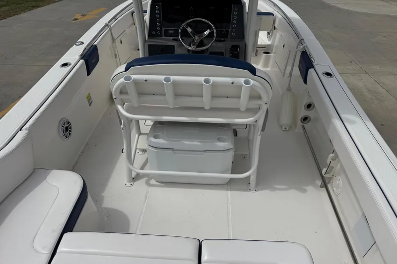 Slide: The Image of 2021 Robalo R242 Explorer boat interior with seating and steering console. - 19