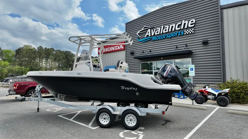 The Image of 2025 Bayliner Trophy 20 boat on trailer at Avalanche Motorsports dealership. - 0