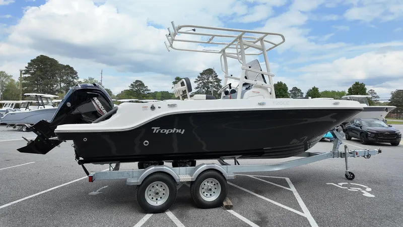 Slide: The Image of 2025 Bayliner Trophy 20 boat on trailer, parked outdoors under a cloudy sky. - 10