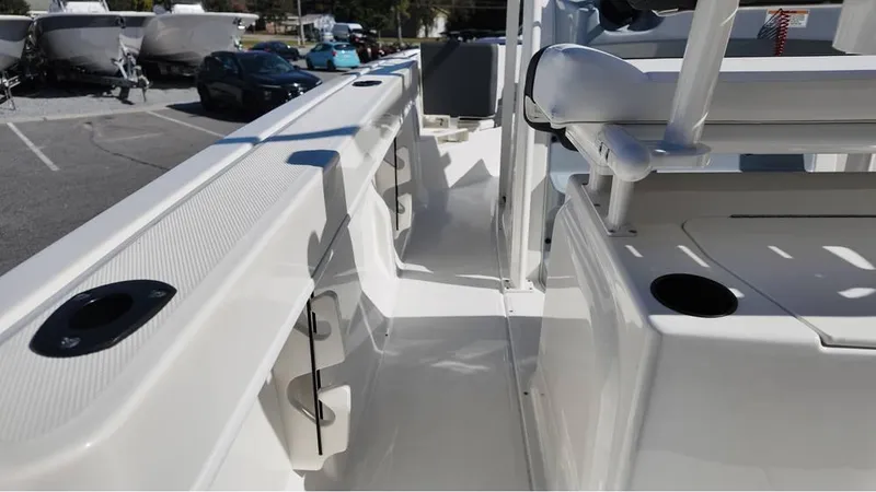 Slide: The Image of 2025 Bayliner Trophy 20 boat interior, showcasing sleek white design and modern features. - 2