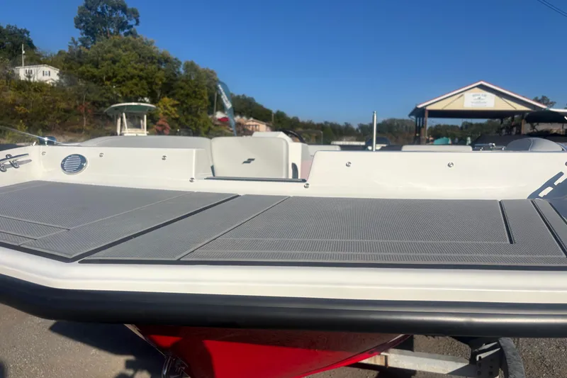 Slide: The Image of 2026 Starcraft SV 16 OB boat on trailer, dockside view under clear blue sky. - 3