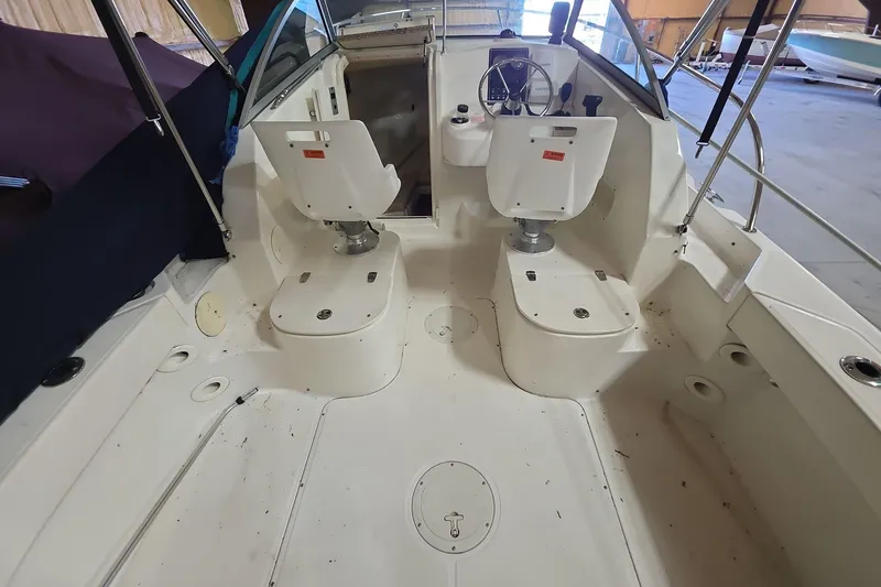 Slide: The Image of 2006 Boston Whaler 205 Conquest boat interior with dual seats and steering wheel. - 15