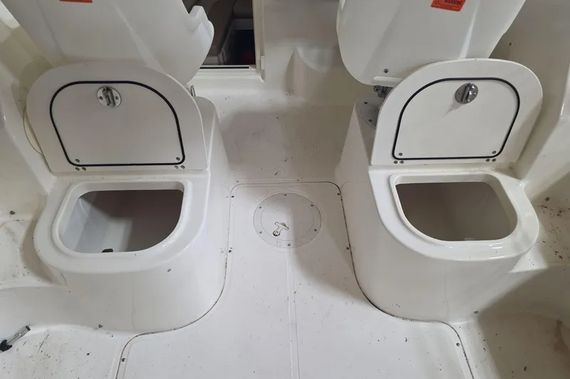 Slide: The Image of 2006 Boston Whaler 205 Conquest boat storage compartments, open and ready for use. - 9