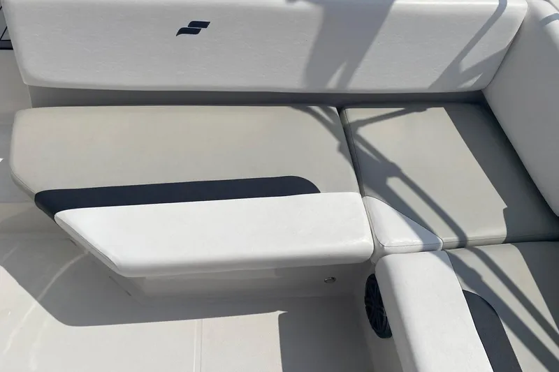 Slide: The Image of 2021 Starcraft SVX 171 OB boat interior seating with gray and white upholstery. - 8