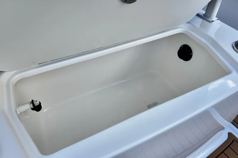 Slide: The Image of 2026 Bayliner Trophy T20CC boat storage compartment, open and empty. - 6
