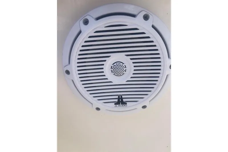 Slide: The Image of White JL Audio speaker on a 2022 Pioneer 202 Islander boat. - 14