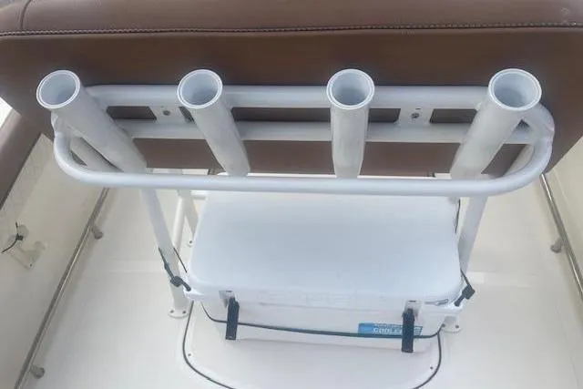 Slide: The Image of 2022 Pioneer 202 Islander boat seat with rod holders and cooler storage. - 15