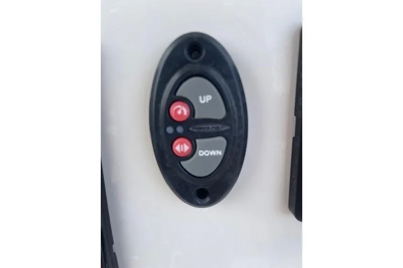 Slide: The Image of Control panel with up and down buttons on 2022 Pioneer 202 Islander boat. - 25