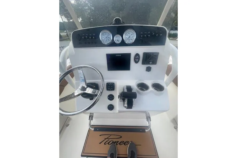 Slide: The Image of Control panel of 2022 Pioneer 202 Islander boat with steering wheel and gauges. - 7