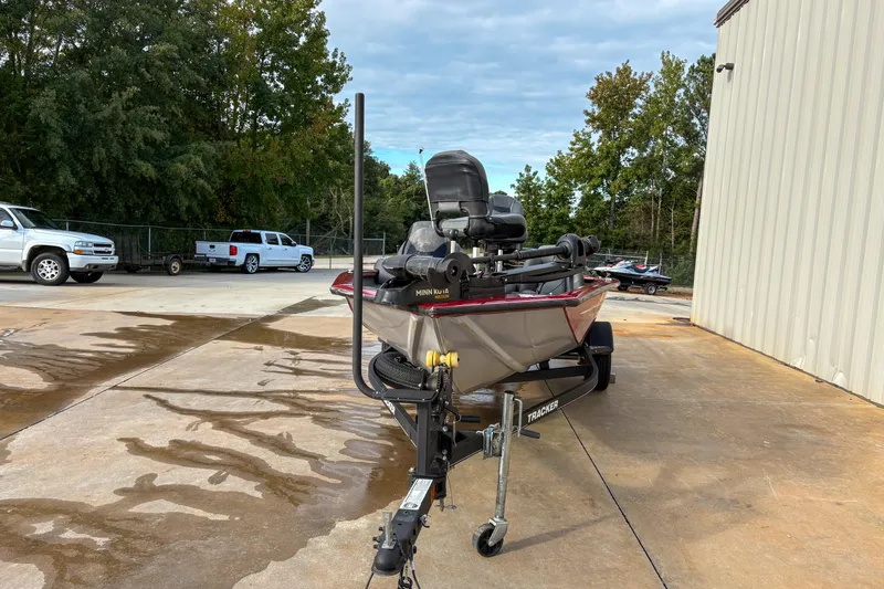 Slide: The Image of 2020 Tracker Pro Team 175 TXW boat on trailer, parked outdoors near a building. - 10