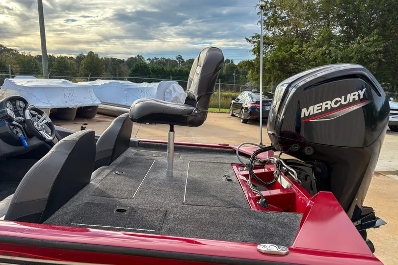 Slide: The Image of 2020 Tracker Pro Team 175 TXW boat with Mercury engine, parked outdoors. - 3