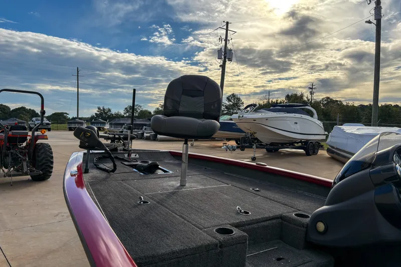 Slide: The Image of 2020 Tracker Pro Team 175 TXW boat on display, surrounded by other boats and a tractor. - 5