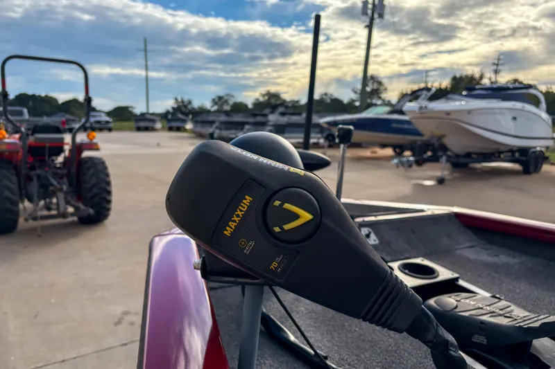 Slide: The Image of 2020 Tracker Pro Team 175 TXW boat with Maxxum trolling motor in a marina setting. - 6