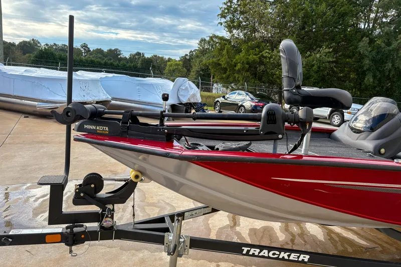 Slide: The Image of 2020 Tracker Pro Team 175 TXW boat with Minn Kota trolling motor on trailer. - 7
