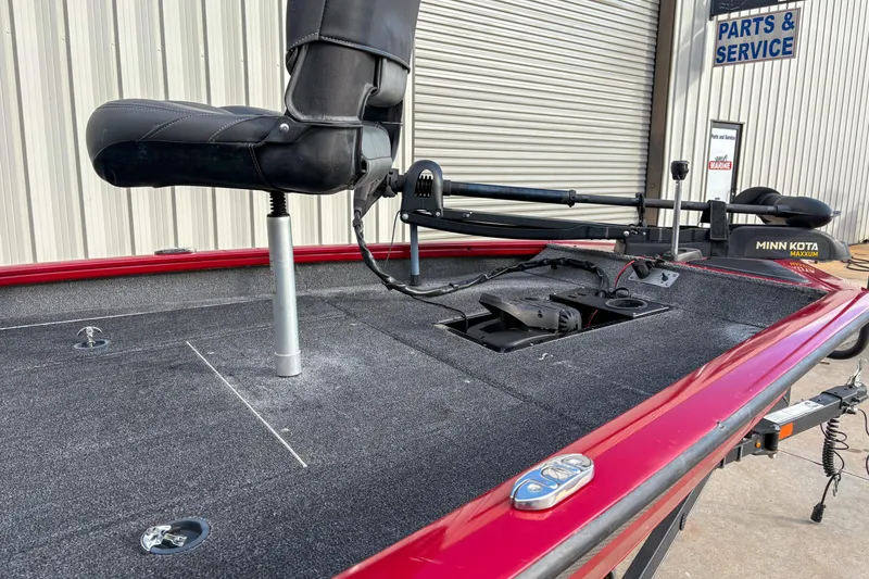 Slide: The Image of 2020 Tracker Pro Team 175 TXW boat with Minn Kota trolling motor, red trim, and black seat. - 8
