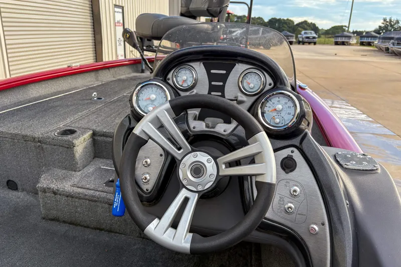 Slide: The Image of 2020 Tracker Pro Team 175 TXW boat dashboard with steering wheel and gauges. - 9