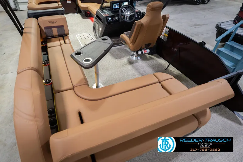 Slide: The Image of 2026 Bennington 22 ML boat interior with tan seating and modern dashboard. - 15