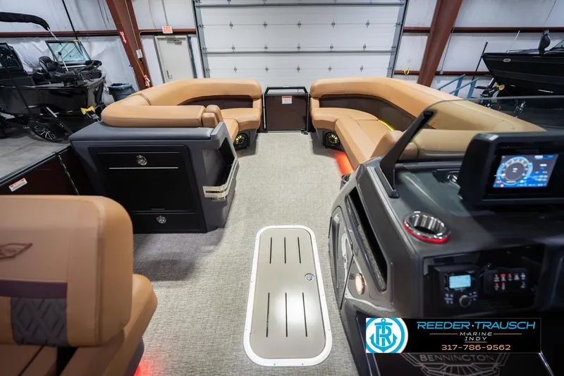 Slide: The Image of 2026 Bennington 22 ML pontoon boat interior with luxurious seating and modern dashboard. - 20