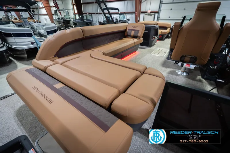 Slide: The Image of Luxurious interior of 2026 Bennington 22 ML pontoon boat with tan seating. - 34