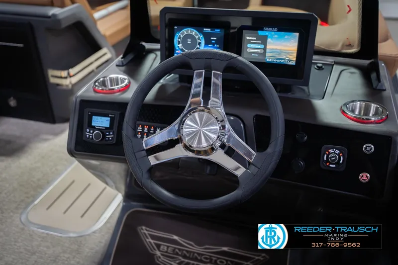 Slide: The Image of 2026 Bennington 22 ML boat dashboard with steering wheel and digital displays. - 35