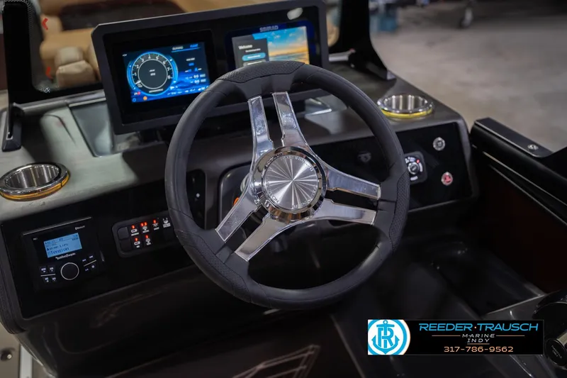 Slide: The Image of 2026 Bennington 22 ML boat dashboard with modern steering wheel and digital displays. - 36