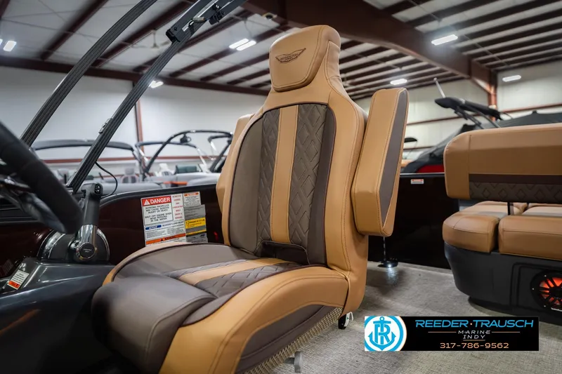 Slide: The Image of Luxurious seating in 2026 Bennington 22 ML boat, featuring premium brown upholstery. - 44