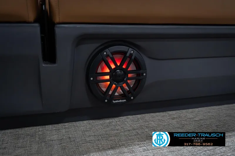 Slide: The Image of 2026 Bennington 22 ML boat speaker with red LED lighting, Reeder-Trausch Marine logo. - 49