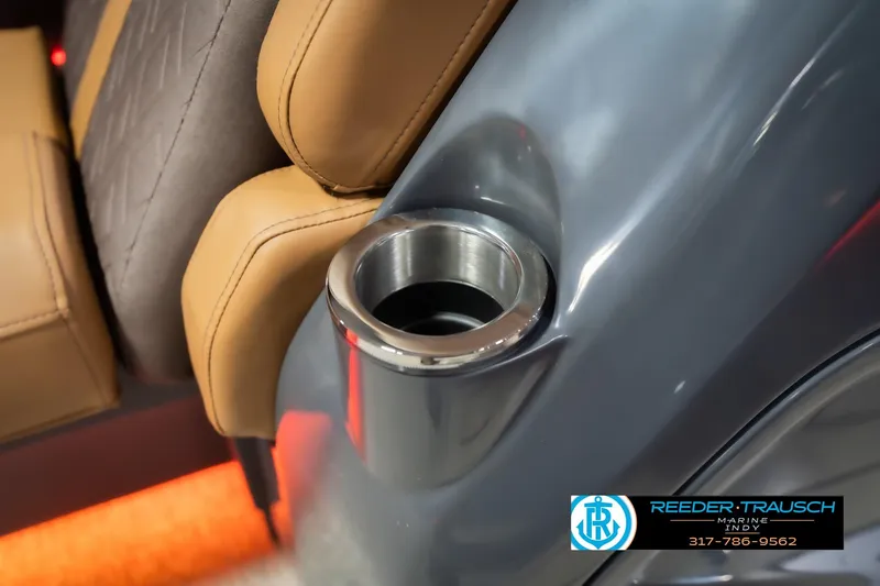 Slide: The Image of Luxurious seating and cup holder in 2026 Bennington 22 ML boat interior. - 51
