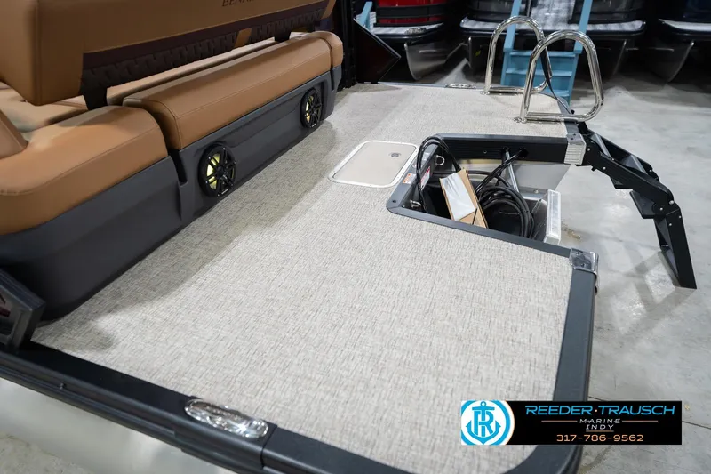 Slide: The Image of 2026 Bennington 22 ML boat interior with seating, speakers, and storage compartment. - 56