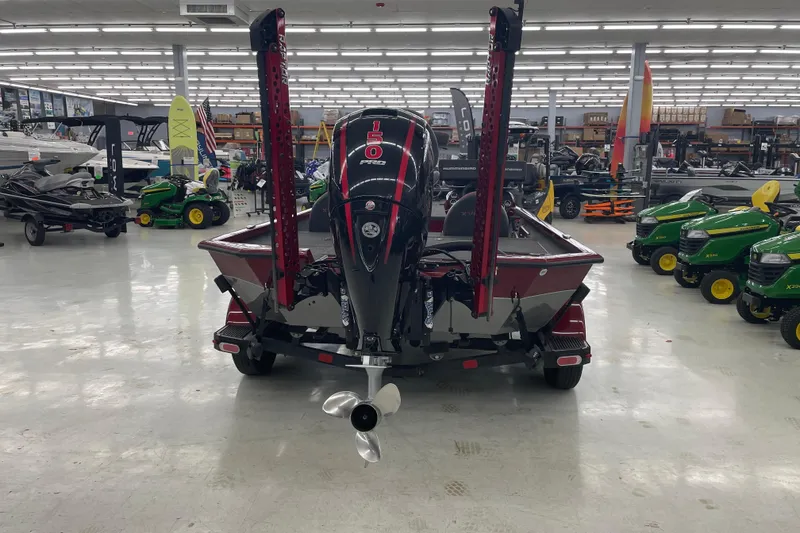 Slide: The Image of 2023 Vexus AVX1980 boat with 150 Pro motor in showroom, surrounded by equipment. - 5