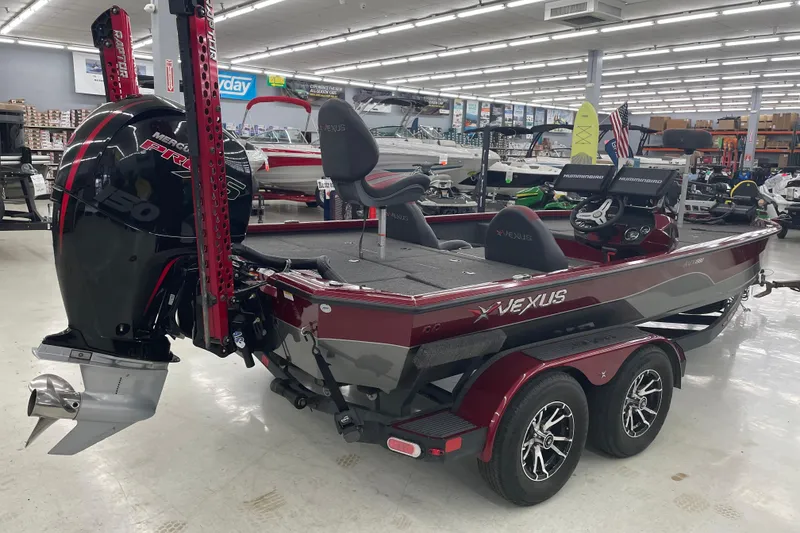 Slide: The Image of 2023 Vexus AVX1980 boat with Mercury engine displayed in showroom. - 6