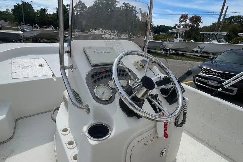 Slide: The Image of 2016 Carolina Skiff 178 DLX boat console with steering wheel and controls. - 7