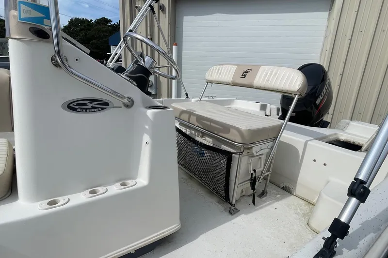 Slide: The Image of 2016 Carolina Skiff 178 DLX boat interior with steering console and seating. - 8