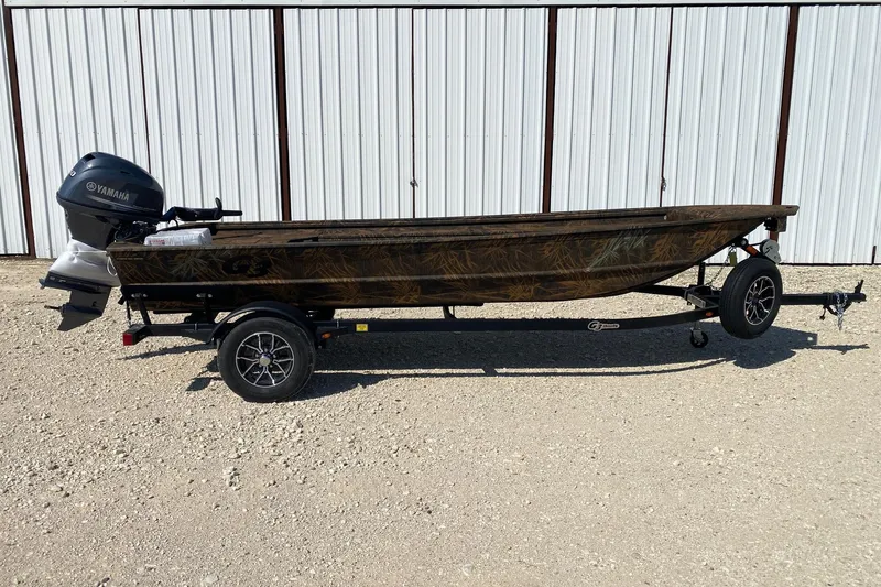 The Image of 2026 G3 16DK boat with Yamaha motor on trailer, parked on gravel. - 0
