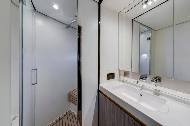 Slide: The Image of Luxurious bathroom interior on 2020 Azimut 60 Fly yacht, featuring modern sink and shower. - 29