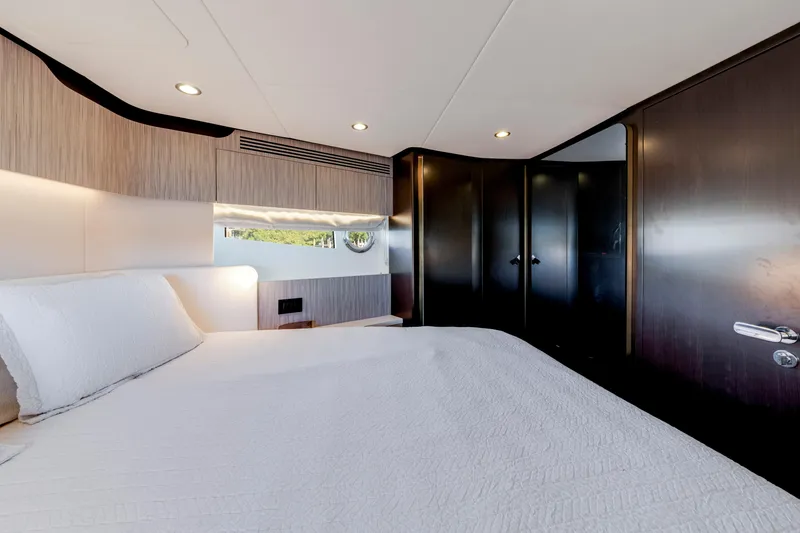 Slide: The Image of Luxurious bedroom interior of 2020 Azimut 60 Fly yacht with modern design and elegant finishes. - 31