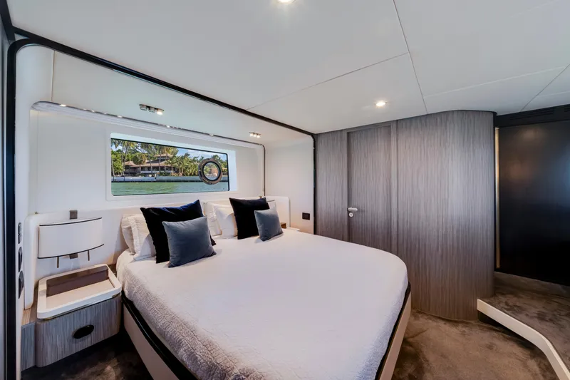 Slide: The Image of Luxurious bedroom interior of 2020 Azimut 60 Fly yacht with modern design and scenic window view. - 33