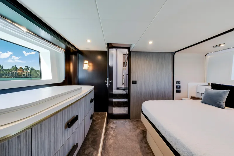 Slide: The Image of Luxurious bedroom interior of 2020 Azimut 60 Fly yacht with modern design and scenic window view. - 34