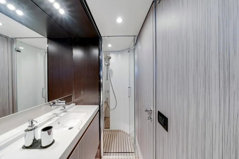 Slide: The Image of Luxurious bathroom on 2020 Azimut 60 Fly yacht, featuring sleek design and modern fixtures. - 36