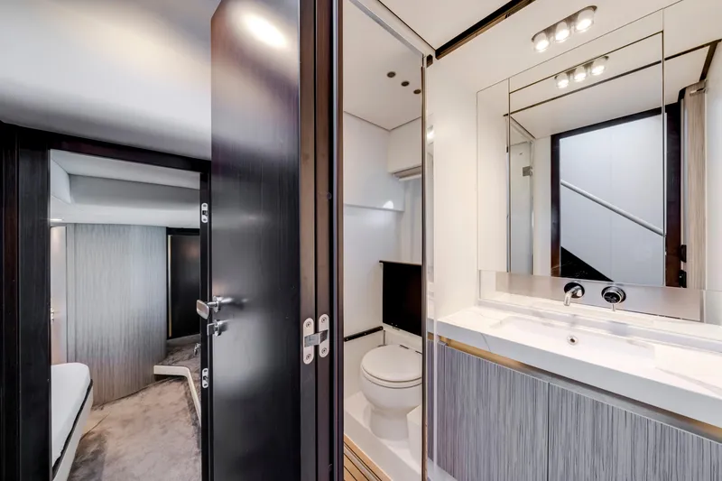 Slide: The Image of Luxurious bathroom interior of 2020 Azimut 60 Fly yacht, featuring modern fixtures and elegant design. - 37