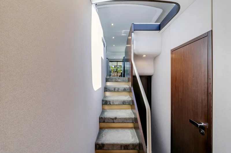 Slide: The Image of Interior staircase of 2020 Azimut 60 Fly yacht, featuring modern design and elegant finishes. - 38